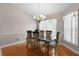 Traditional dining room features a glass table, ornate chairs, and a chandelier at 5460 Sw 103Rd Street Rd, Ocala, FL 34476