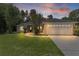 Charming home boasts a well-manicured lawn, inviting walkway, and attached two-car garage at 5460 Sw 103Rd Street Rd, Ocala, FL 34476