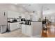 Spacious kitchen with granite countertops, white cabinets, and appliances at 5460 Sw 103Rd Street Rd, Ocala, FL 34476