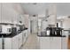 Spacious kitchen with granite countertops, white cabinets, and appliances at 5460 Sw 103Rd Street Rd, Ocala, FL 34476