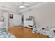 Bright bedroom with hardwood floors, ceiling fan and ample natural light at 5460 Sw 103Rd Street Rd, Ocala, FL 34476