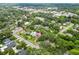 This aerial shot shows the lovely home surrounded by lush trees in a quiet, established neighborhood at 601 S 12Th St, Leesburg, FL 34748