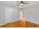Bright bedroom with hardwood floors and a ceiling fan at 601 S 12Th St, Leesburg, FL 34748