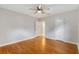 Cozy bedroom featuring hardwood floors, a ceiling fan and two closets at 601 S 12Th St, Leesburg, FL 34748
