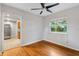 Dining room featuring hardwood floors and a view into the adjacent kitchen at 601 S 12Th St, Leesburg, FL 34748