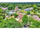 Neighborhood home featuring a pool and lush green surroundings at 6316 Marlberry Dr, Orlando, FL 32819