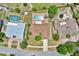 A bird's eye view of a single-Gathering home featuring a private backyard pool, lush landscaping, and a classic suburban setting at 6316 Marlberry Dr, Orlando, FL 32819