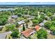 An aerial view of a quiet, tree-filled neighborhood featuring well-kept homes, private pools, and convenient access to the community golf course at 6316 Marlberry Dr, Orlando, FL 32819