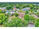 Expansive aerial view of home featuring a pool and lush landscaping at 6316 Marlberry Dr, Orlando, FL 32819