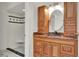 Elegant bathroom vanity with custom cabinets and a separate shower area at 6316 Marlberry Dr, Orlando, FL 32819