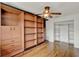 Bedroom showcasing built-in shelving and hardwood floors at 6316 Marlberry Dr, Orlando, FL 32819