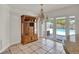 Dining area featuring a wooden hutch and sliding glass doors leading to the pool at 6316 Marlberry Dr, Orlando, FL 32819