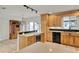 Well-equipped kitchen with stainless steel appliances, granite countertops, and custom wood cabinetry at 6316 Marlberry Dr, Orlando, FL 32819