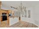 Kitchen with stainless appliances, custom wood cabinets, and open design to the living area at 6316 Marlberry Dr, Orlando, FL 32819