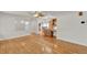 Open-concept living room featuring hardwood floors, natural light and a view of the kitchen at 6316 Marlberry Dr, Orlando, FL 32819