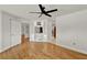 Open-concept living area with hardwood floors and built-in media center at 6316 Marlberry Dr, Orlando, FL 32819