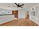 Spacious room with hardwood floors, and built-in bookcases, ready for your personal touches at 6316 Marlberry Dr, Orlando, FL 32819