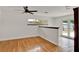 Bright living room with hardwood floors, ceiling fan, and access to the patio at 6316 Marlberry Dr, Orlando, FL 32819
