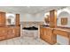Luxurious main bathroom with a jacuzzi tub and dual vanities with granite counters at 6316 Marlberry Dr, Orlando, FL 32819