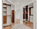 Well-organized walk-in closet with custom shelving and mirrored doors at 6316 Marlberry Dr, Orlando, FL 32819