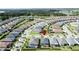An elevated real estate shot of a well manicured neighborhood with mature trees and lawns at 655 Conservation Blvd, Groveland, FL 34736
