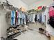 Walk-in closet with ample hanging space and shelving for shoes and accessories, providing great storage solutions at 655 Conservation Blvd, Groveland, FL 34736