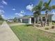 Charming single-story home featuring a well-maintained lawn, landscaping, and a two-car garage at 655 Conservation Blvd, Groveland, FL 34736