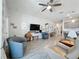 Bright living room featuring tile floors, neutral walls, modern furniture, and a ceiling fan at 655 Conservation Blvd, Groveland, FL 34736