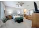 Cozy main bedroom showcasing beautiful furnishings and a private ensuite bathroom at 655 Conservation Blvd, Groveland, FL 34736
