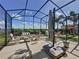 Expansive screened-in patio with multiple seating areas, offering a perfect space for outdoor relaxation and entertainment at 655 Conservation Blvd, Groveland, FL 34736