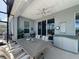 Enclosed patio features a ceiling fan, a dining table, and a serving and storage unit for seamless outdoor living at 655 Conservation Blvd, Groveland, FL 34736