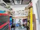 Organized garage workbench area with tools, shelving, and a convenient setup for various projects and repairs at 655 Conservation Blvd, Groveland, FL 34736