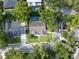 Aerial view of a charming home in a tree-lined neighborhood, showcasing its well-manicured lawn and inviting street presence at 681 Greywood Dr, Altamonte Springs, FL 32701