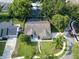 Aerial view of a home with a backyard pool, surrounded by lush trees in a well-established neighborhood at 681 Greywood Dr, Altamonte Springs, FL 32701