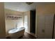 Bathroom includes an elegant soaking tub, glass block window, tiled shower and lots of storage at 681 Greywood Dr, Altamonte Springs, FL 32701