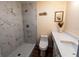 This is a renovated bathroom with a tiled shower, a modern toilet, and a vanity with gold hardware at 681 Greywood Dr, Altamonte Springs, FL 32701