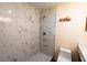 This is a renovated bathroom featuring a tiled shower, a toilet, and a vanity with gold hardware at 681 Greywood Dr, Altamonte Springs, FL 32701