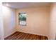 Cozy bedroom with wood-look flooring and a window offering natural light at 681 Greywood Dr, Altamonte Springs, FL 32701