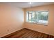 Bright bedroom features wood floors, neutral walls, and a large window, perfect for a cozy retreat at 681 Greywood Dr, Altamonte Springs, FL 32701