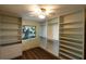 Bedroom featuring custom built-in storage shelves and plank floors at 681 Greywood Dr, Altamonte Springs, FL 32701