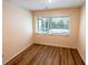Clean bedroom boasts wood floors and large window, providing lots of natural light at 681 Greywood Dr, Altamonte Springs, FL 32701