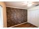 Bedroom featuring an accent wall, ceiling fan, and a spacious closet at 681 Greywood Dr, Altamonte Springs, FL 32701
