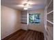 Bedroom with built-in storage, large window and plank floors at 681 Greywood Dr, Altamonte Springs, FL 32701