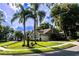 Well-maintained home on a corner lot, featuring mature palm trees and lush landscaping for a tropical feel at 681 Greywood Dr, Altamonte Springs, FL 32701