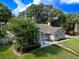 Well-manicured lawn and lush landscaping surround this home, offering beautiful curb appeal and a welcoming atmosphere at 681 Greywood Dr, Altamonte Springs, FL 32701