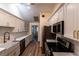 Bright kitchen with stainless appliances, white cabinets, subway tile backsplash, and hardwood floors at 681 Greywood Dr, Altamonte Springs, FL 32701