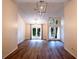 Elegant living space showcasing wood-look flooring, vaulted ceilings and a view of the outdoors at 681 Greywood Dr, Altamonte Springs, FL 32701
