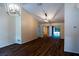 Inviting living room with modern light fixtures, vaulted ceiling and wood-look floors at 681 Greywood Dr, Altamonte Springs, FL 32701