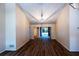 Bright living room boasts wood-look floors, vaulted ceiling, and contemporary lighting fixtures at 681 Greywood Dr, Altamonte Springs, FL 32701