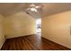 A spacious living room featuring hardwood floors, a ceiling fan, and warm yellow walls at 681 Greywood Dr, Altamonte Springs, FL 32701